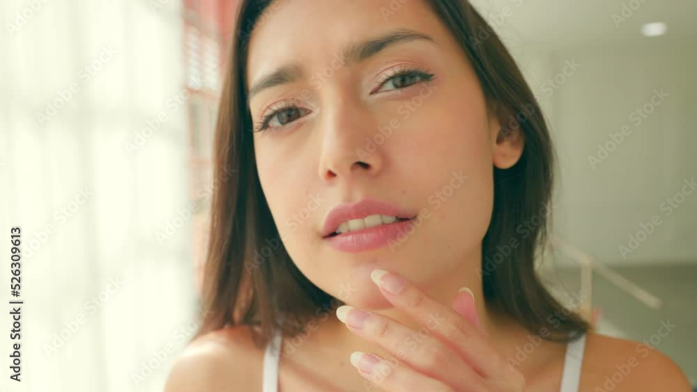 young woman applying lotion enjoying healthy skin care. young woman applying lotion enjoying healthy skin care.