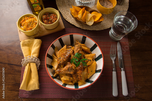 Noodles bolognese with chicken wings peru peruvian gourmet restaurant popular comfort food