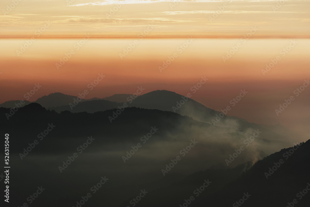 Foggy Mountains during Sunset hour Foggy Mountains during Sunset hour