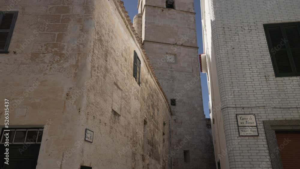 Santa Eulalia d'Alaior church from narrow street in Alaior, Alaior, Menorca, Balearic Islands Santa Eulalia d'Alaior church from narrow street in Alaior, Alaior, Menorca, Balearic Islands