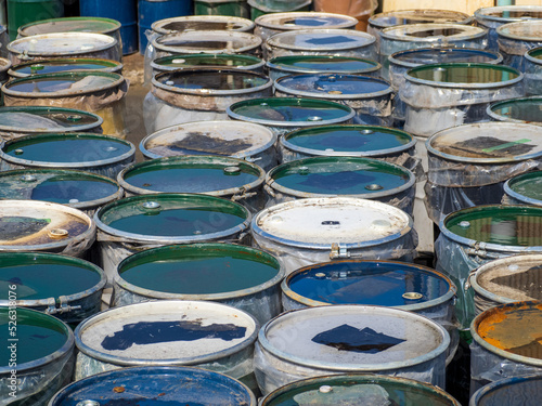 Colorful oil drums line up outside