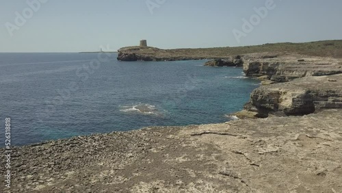 Drone shot of the Mediterranean Sea and Torre de Alcaufar, Menorca, Balearic Islands photo