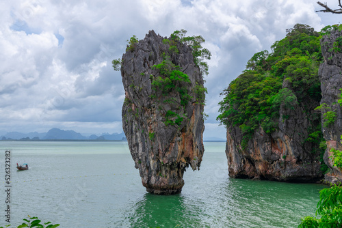 Phangna Bay with many Islands near Phuket Thailand. Lovely rock in the middle of the ocean surrounded by mountains