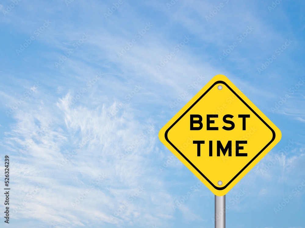Yellow transportation sign with word best time on blue color sky background Yellow transportation sign with word best time on blue color sky background
