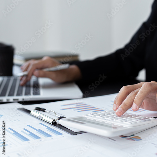 Accounting businessmen are calculating income-expenditure and analyzing real estate investment data, Financial and tax systems concept.