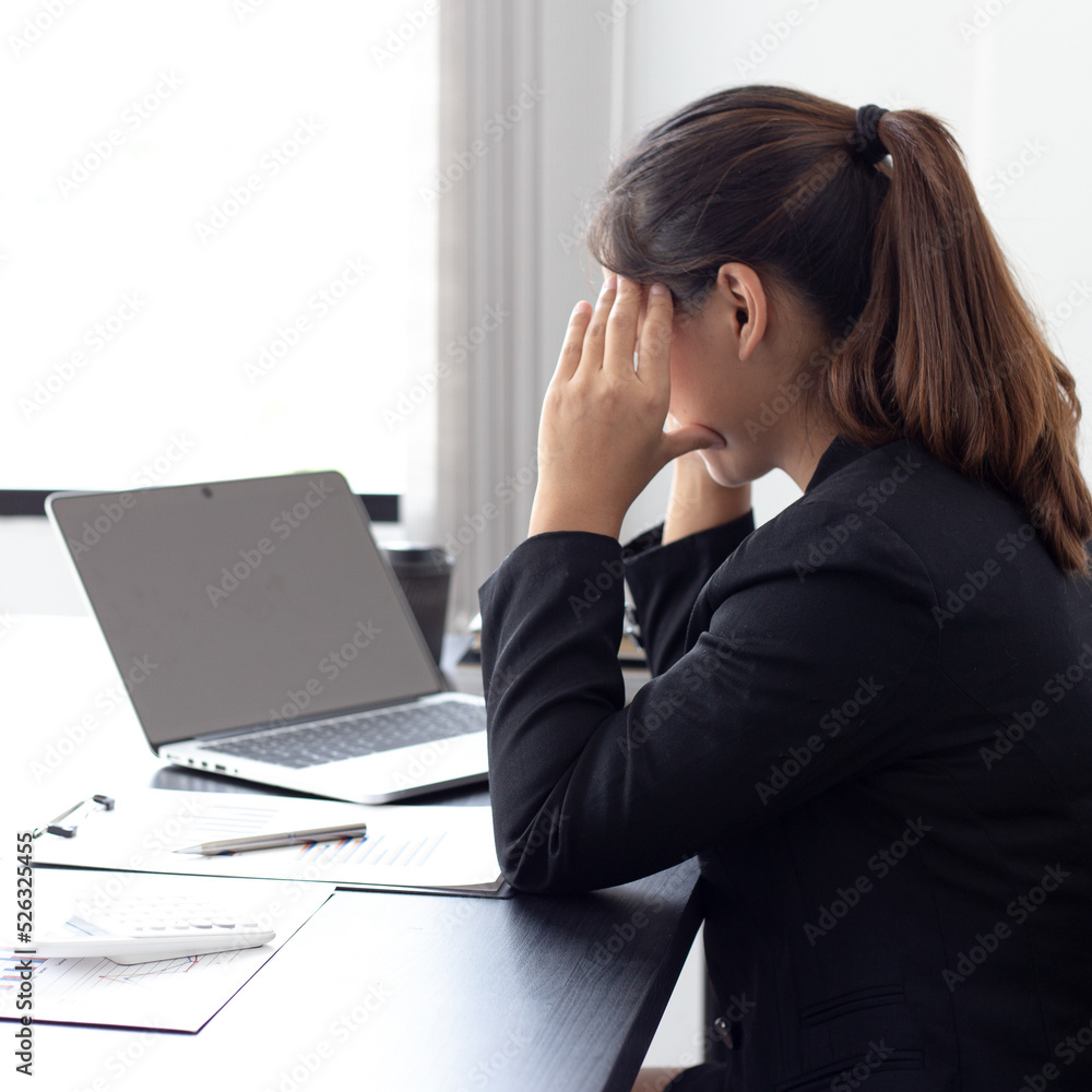 She is stressed due to the economic downturn causing migraine headaches, Financial accountants work on the analysis and summary of company revenue in real estate, Hard work and overtime work concept. She is stressed due to the economic downturn causing migraine headaches, Financial accountants work on the analysis and summary of company revenue in real estate, Hard work and overtime work concept.