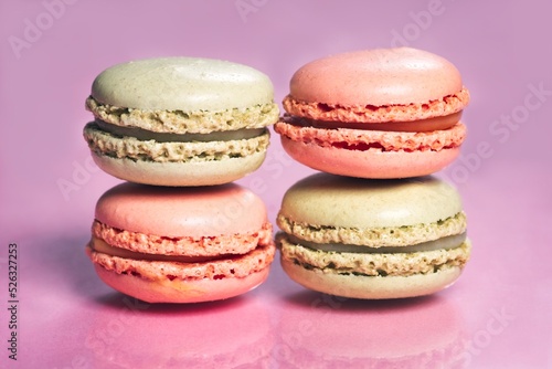 Fototapeta Naklejka Na Ścianę i Meble -  Stack of tasty french macarons on a pink pastel background.