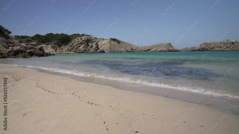 Waves lapping on beach at Platja Arenal d'en Castell, Arenal d'en Castell, Menorca, Balearic Islands Waves lapping on beach at Platja Arenal d'en Castell, Arenal d'en Castell, Menorca, Balearic Islands