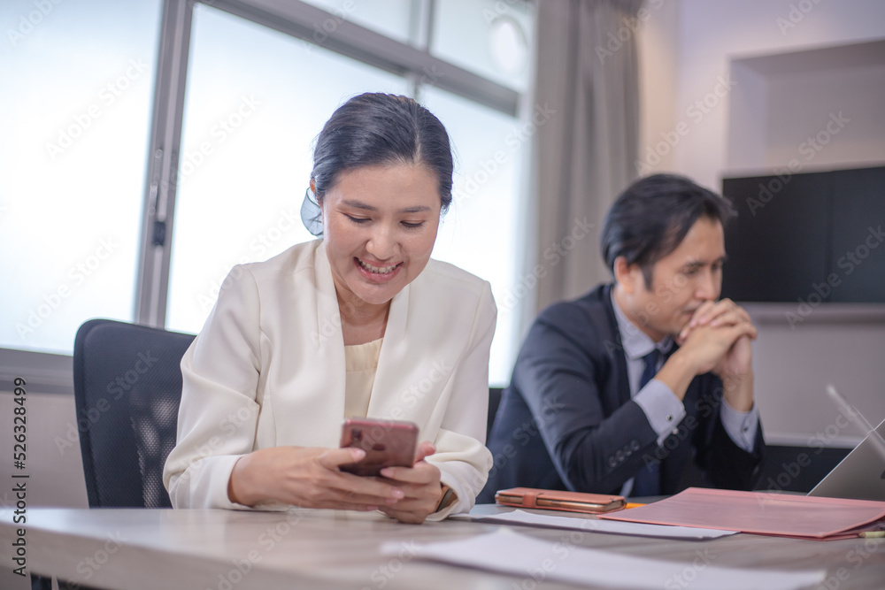 Business people meeting and discussing documents and ideas at meeting around table. Business people meeting and discussing documents and ideas at meeting around table.