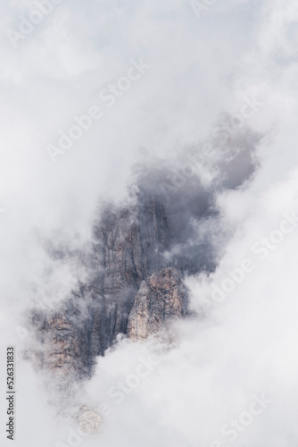 Scenic view of of a wild mountain peak in a clouds' frame