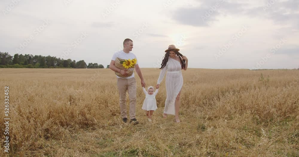 Young parents teach their baby to walk Young parents teach their baby to walk