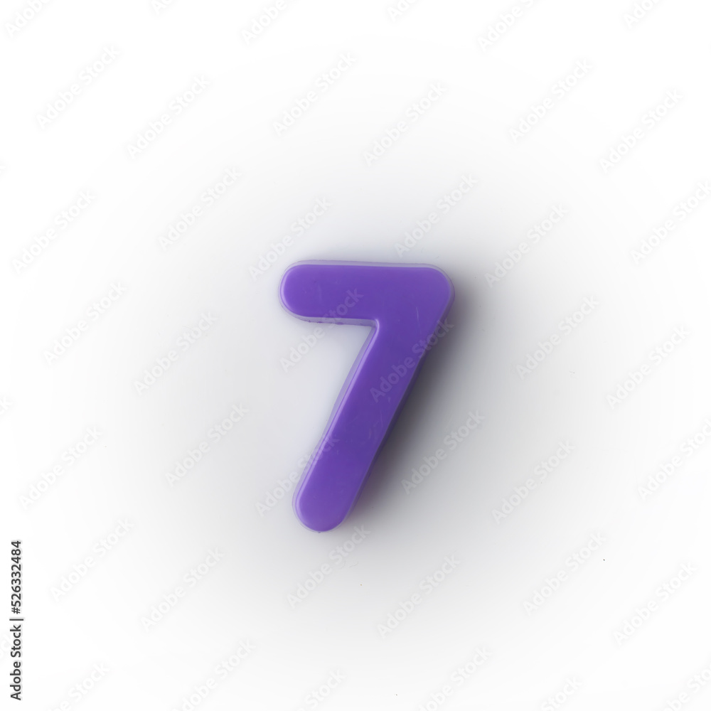 Plastic magnetic number 7 seven purple on a white background top view. Plastic magnetic number 7 seven purple on a white background top view.