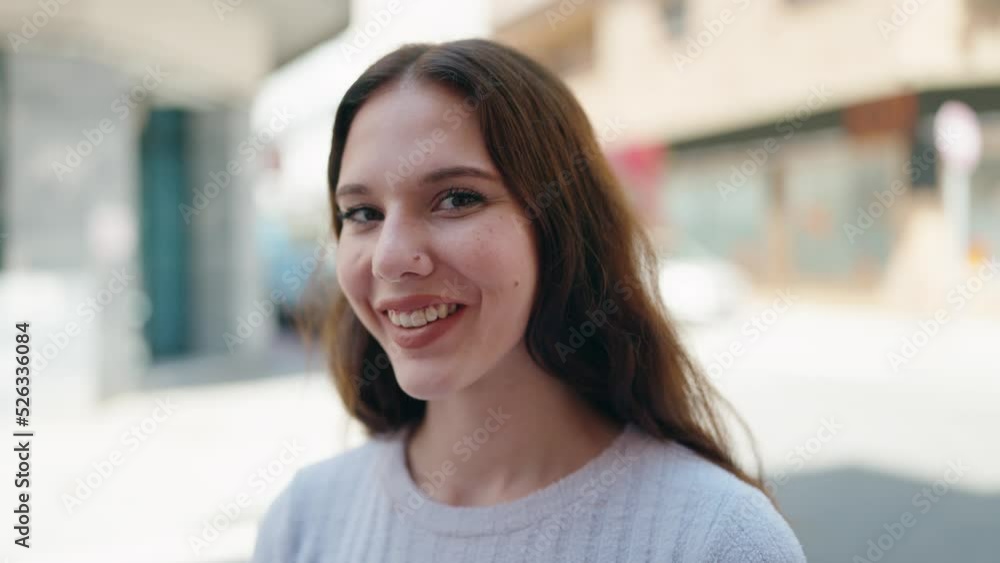 Young woman smiling confident standing at street Young woman smiling confident standing at street