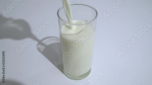 Milk is poured into a glass