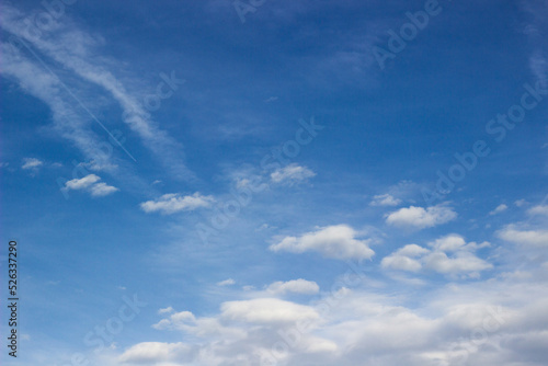 Beautiful sky with white clouds background. Light cumulus clouds in the blue sky