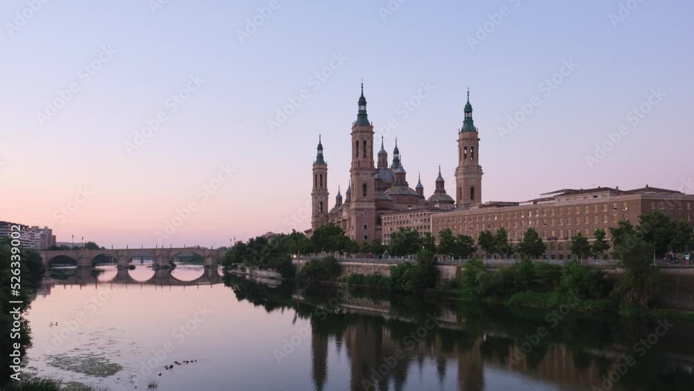 Sunrise timelapse at Basilica of Our Lady of the Pillar and Ebro river at sunrise in Zaragoza, Spain. El Pilar de Zaragoza. Sunrise timelapse at Basilica of Our Lady of the Pillar and Ebro river at sunrise in Zaragoza, Spain. El Pilar de Zaragoza.