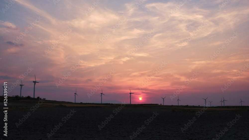 Sunset timelapse of the wind turbines at wind farm in Zaragoza, Spain. Alternative energy sources. Sunset timelapse of the wind turbines at wind farm in Zaragoza, Spain. Alternative energy sources.