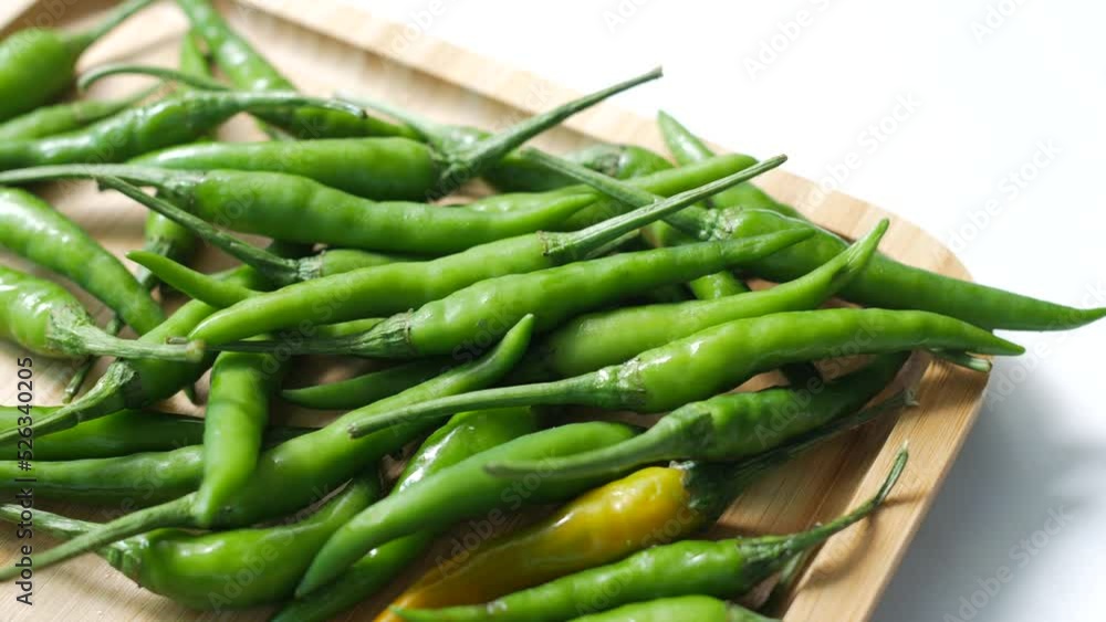 close up of green chili on a chopping board close up of green chili on a chopping board
