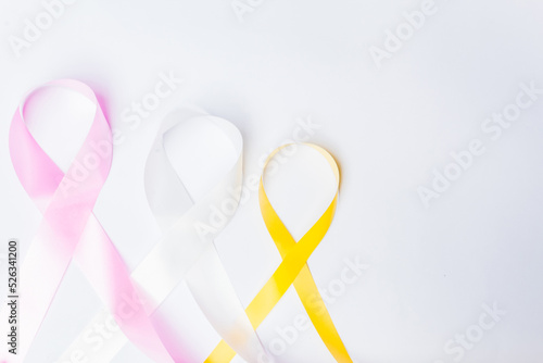 pink ribbon fight against breast cancer, white ribbon, fight against violence against women, yellow ribbon, fight against suicide prevention, isolated on white background.