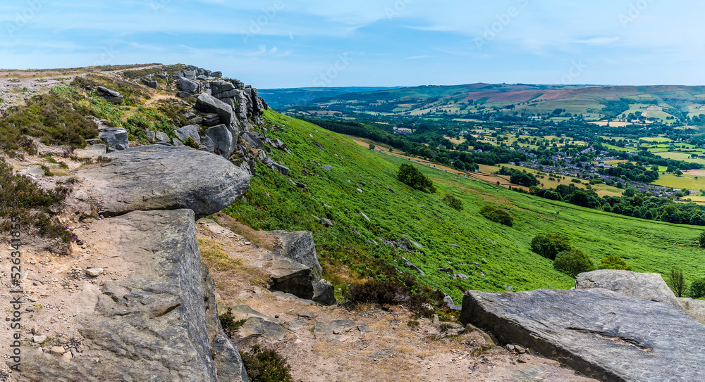 A view along the rocky cliff edge on the top of Bamford Edge, UK in summertime