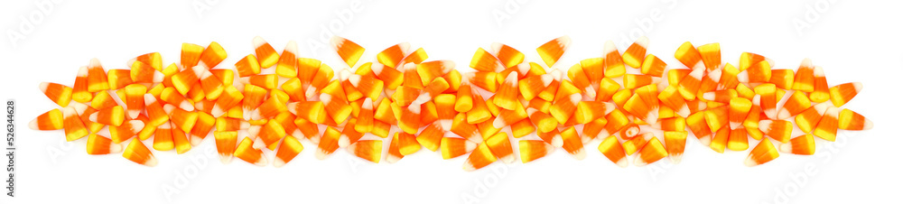 Halloween candy corn border banner. Top view isolated on a white background.