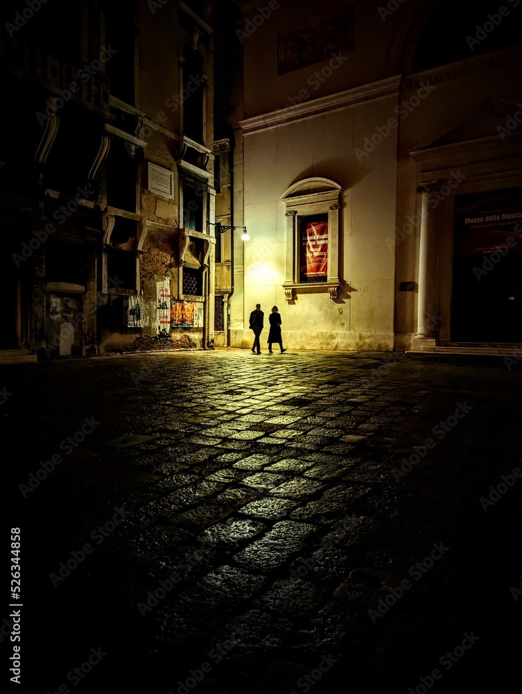 Couple Under Streetlight on Quiet Venice Night