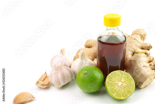 Ginger herb with honey and lemon and garlic isolated on white background.