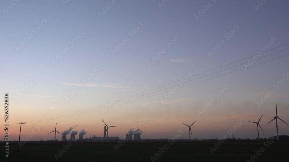 Coal fired power station with the sun in background and pylons taking electricity through wires in the North of England Hull UK 4K Coal fired power station with the sun in background and pylons taking electricity through wires in the North of England Hull UK 4K
