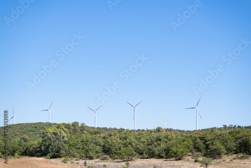 Onshore horizontal axis wind turbines in South of France, Europe. Panoramic shot with copy space allowing seamless integration of your custom text, titles, headings, or graphic elements photo