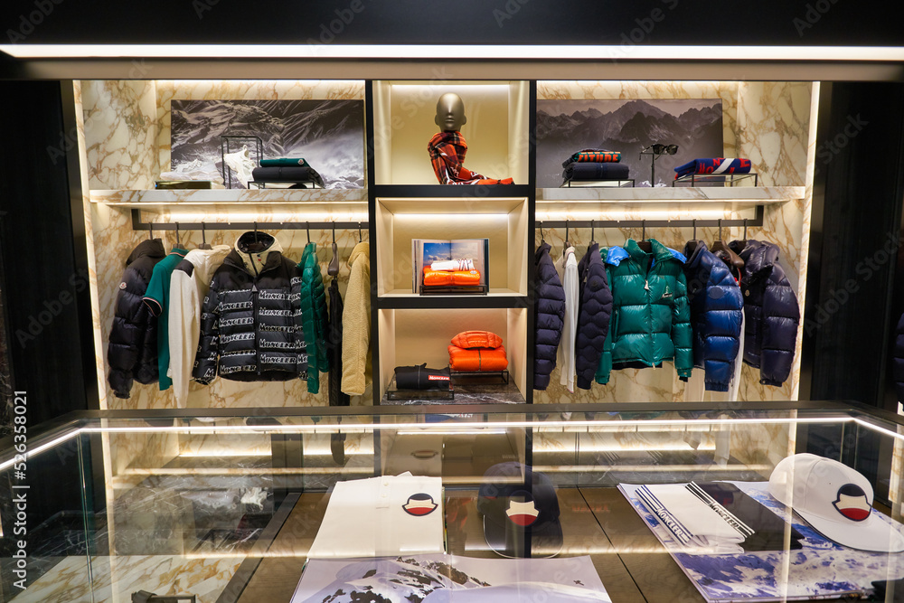 SINGAPORE - JANUARY 21, 2020: clothes on display at Moncler store in  Singapore Changi Airport. Moncler S.p.A is an apparel brand mostly known  for its skiwear. Stock Photo | Adobe Stock