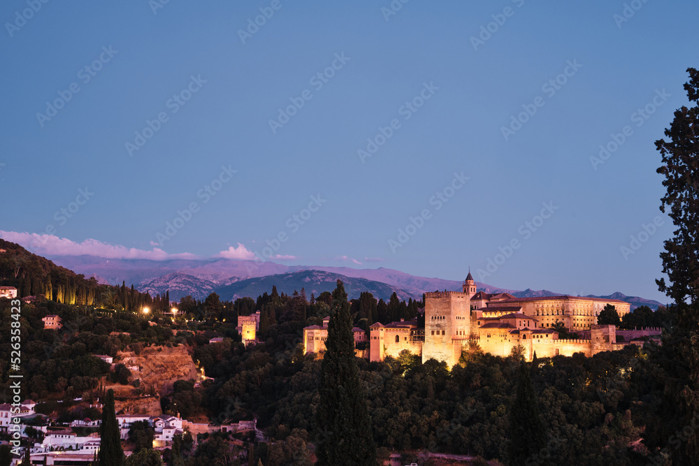 Views of the Alhambra at sunset from a lookout point. Granada, Spain.