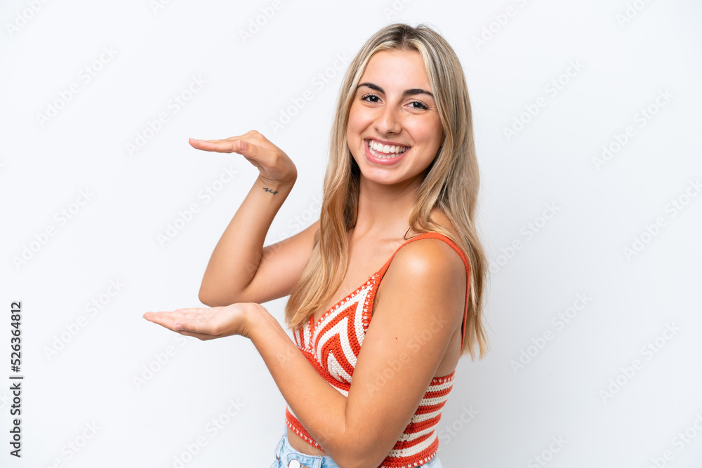 Young caucasian woman isolated on white background holding copyspace to insert an ad Young caucasian woman isolated on white background holding copyspace to insert an ad
