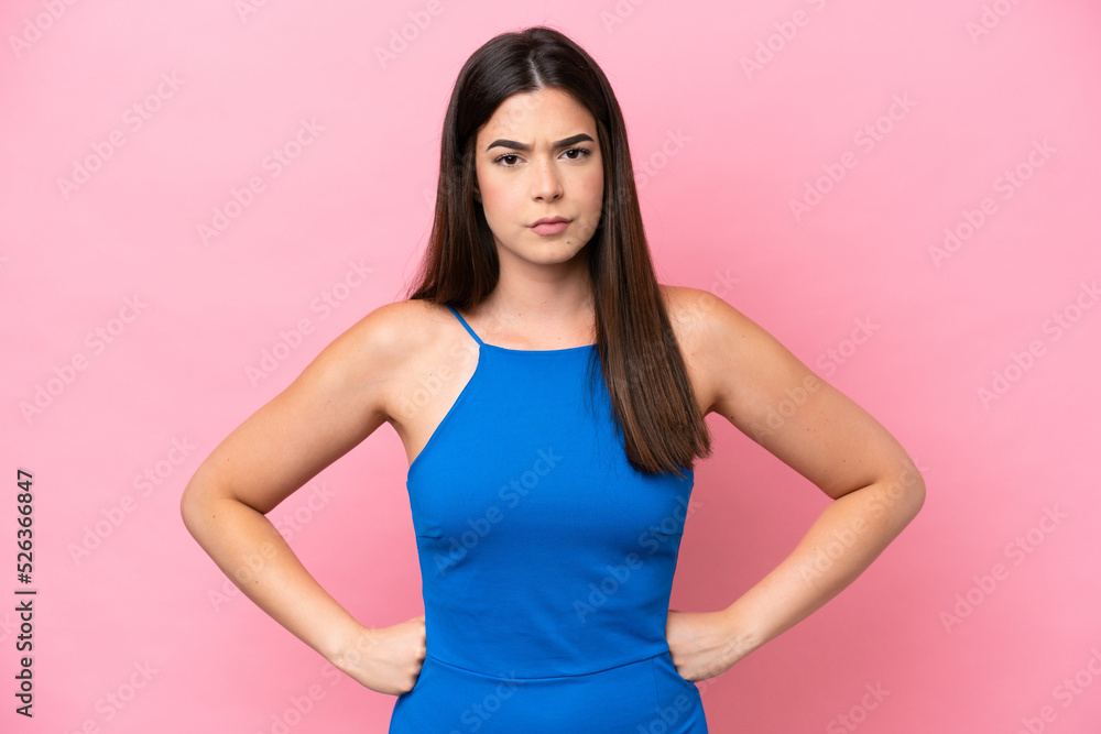 Young Brazilian woman isolated on pink background angry Young Brazilian woman isolated on pink background angry