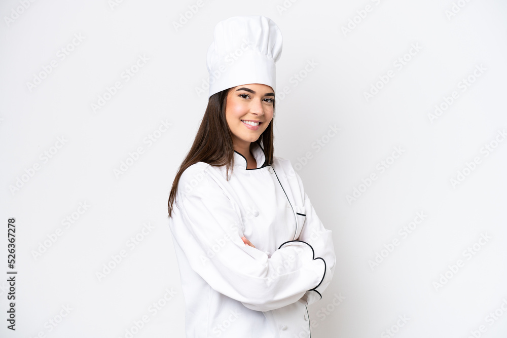 Young Brazilian chef woman isolated on white background with arms crossed and looking forward Young Brazilian chef woman isolated on white background with arms crossed and looking forward