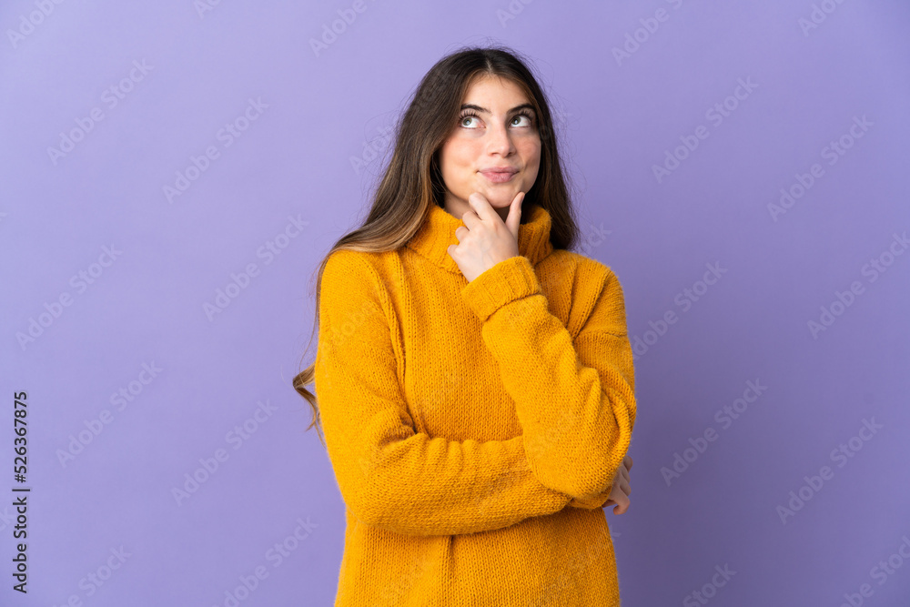 Young caucasian woman isolated on purple background thinking an idea while looking up Young caucasian woman isolated on purple background thinking an idea while looking up