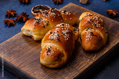 Delicious homemade pastries with apricot jam sprinkled with sesame seeds