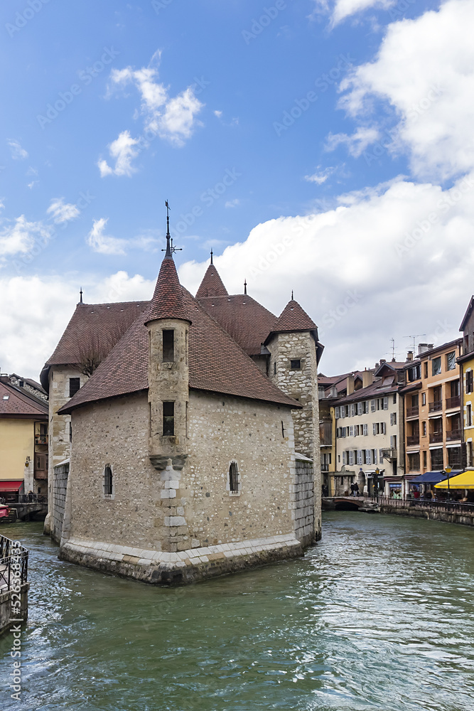 Medieval insular Palais de l'Isle (Isle Palace) in Annecy, which date from the 12th century. Isle Palace look like a stone ship. Annecy, Haute-Savoie department, Auvergne-Rhone-Alpes region, France.