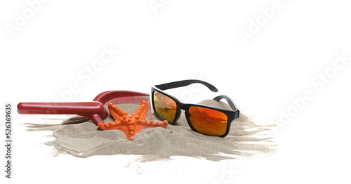 Sand, toys and sunglasses isolated on white 