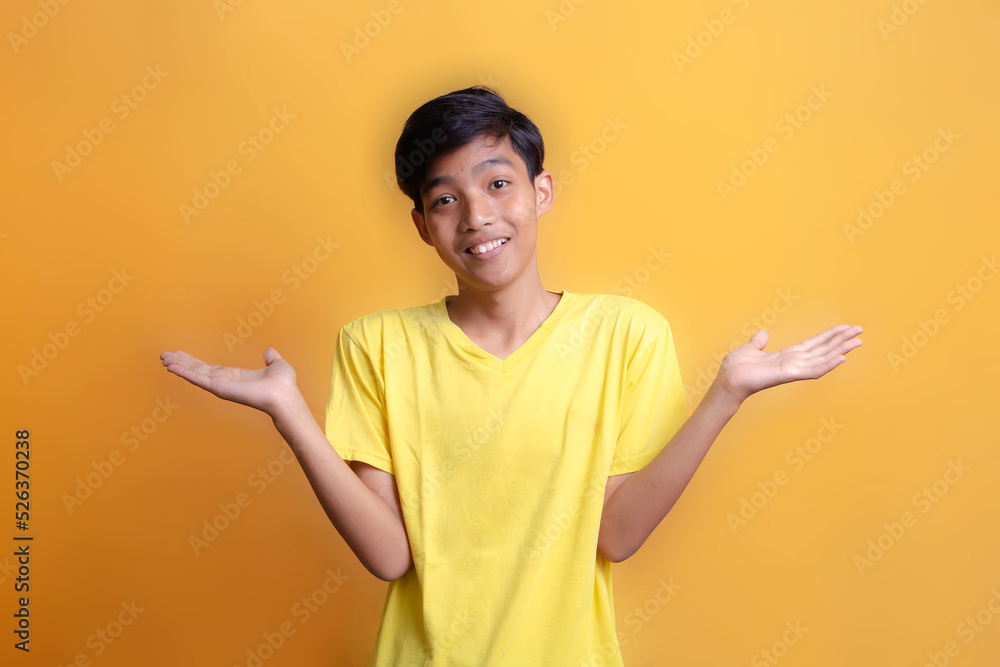 Portrait of Asian young man wearing yellow t-shirt. By describing the experience