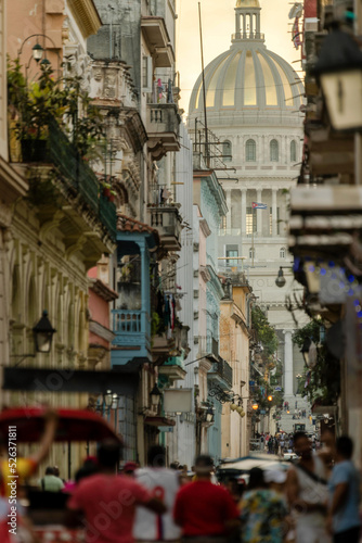 Walking old town Havana towards Capitol at sunset.