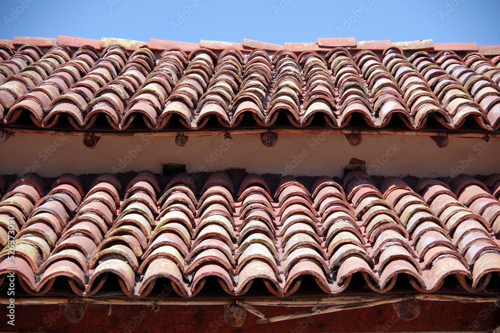 Partial view of an old Mexican tile roof Partial view of an old Mexican tile roof
