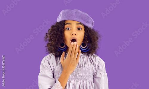 Canvas Print Portrait of stunned teen African American girl isolated on purple studio background feel shocked by unexpected news