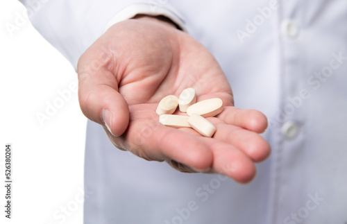 pills and medications. hands hold medication. vitamin pills closeup