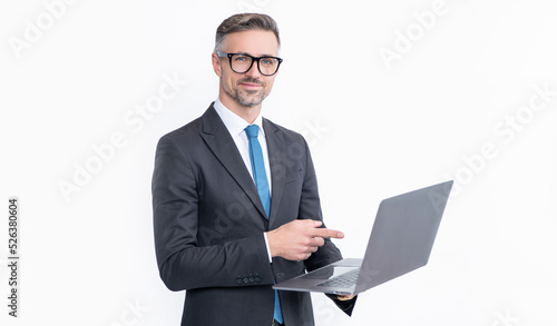 cheerful mature businessman working on laptop isolated on white background