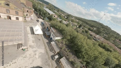 FPV drone view of old ruined factory for events, holidays and performances. Art space and installations.
 photo