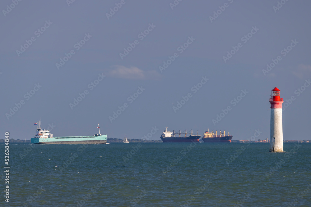Phare de Chauvea near Ile de Re with ships to La Rochelle, Pays de la Loire, France Phare de Chauvea near Ile de Re with ships to La Rochelle, Pays de la Loire, France