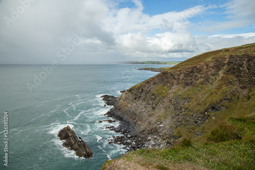 Cloudy day with blue sky at Old Head of Kinsale, County Cork, Ireland. photo