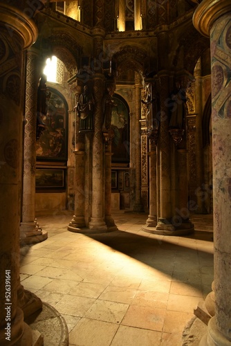 Soft autumn rays of light illuminate the rotunda of the Knights Templar church at Convent of Christ in rich Manueline decorations and flamboyant late Gothic frescoes, Tomar, Portugal