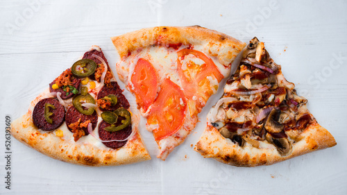 three slices of pizza on a white background