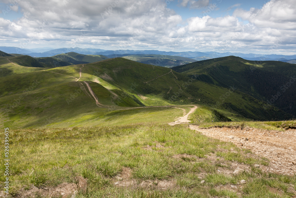 mountain roads along green peaks in rural Carpathians
